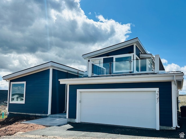 2747 S Country Club Way, Garden City, UT 84028 - view of front of home with an attached garage and driveway