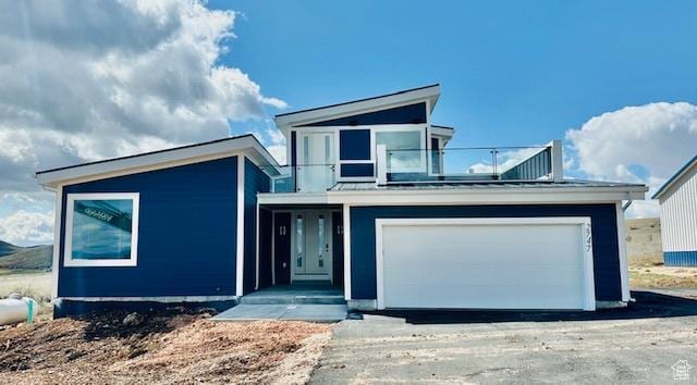 view of front of home with aphalt driveway