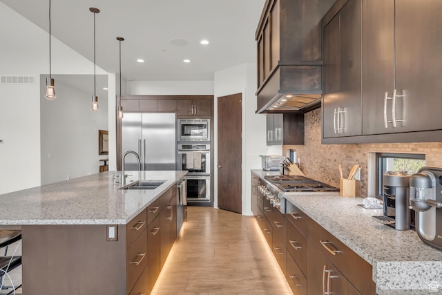 1622 E Abajo Peak Cir Unit Tv-23, Heber City, UT 84032 - kitchen with a sink, light wood-style floors, built in appliances, custom range hood, and visible vents