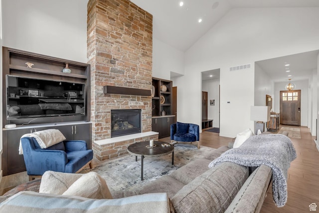 1622 E Abajo Peak Cir Unit Tv-23, Heber City, UT 84032 - living room with visible vents, recessed lighting, wood finished floors, a stone fireplace, and high vaulted ceiling