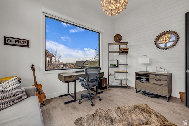 1622 E Abajo Peak Cir Unit Tv-23, Heber City, UT 84032 - office space featuring light wood finished floors, wooden walls, baseboards, and an inviting chandelier