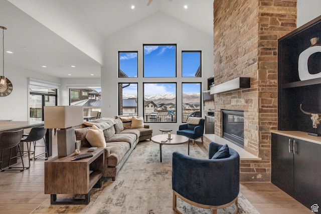 1622 E Abajo Peak Cir Unit Tv-23, Heber City, UT 84032 - living area with a fireplace, wood finished floors, and high vaulted ceiling