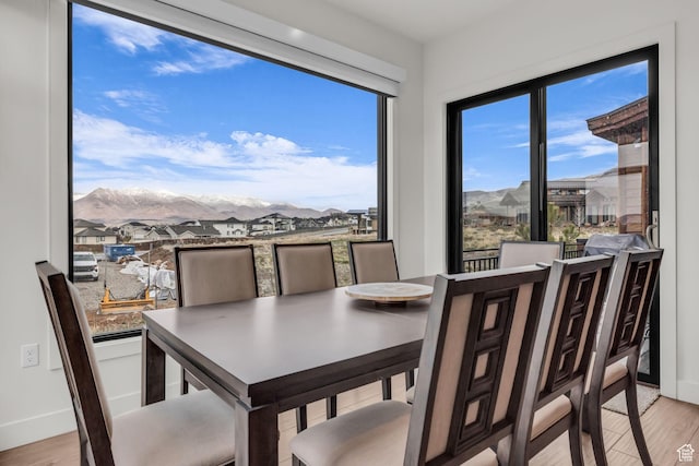 1622 E Abajo Peak Cir Unit Tv-23, Heber City, UT 84032 - dining space featuring a mountain view, baseboards, and light wood-style flooring