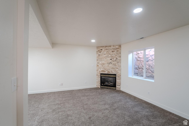 2976 E Saddle Rock Rd, Eagle Mountain, UT 84005 - unfurnished living room featuring recessed lighting, visible vents, baseboards, carpet flooring, and a large fireplace