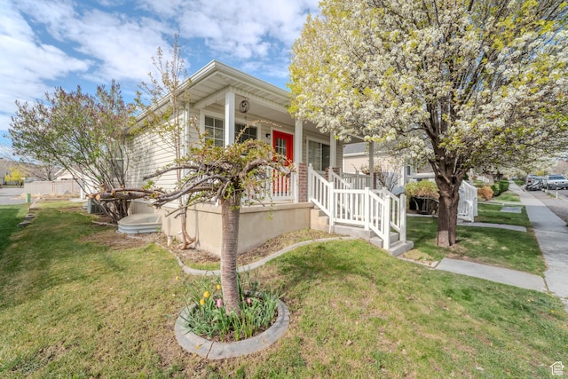 2976 E Saddle Rock Rd, Eagle Mountain, UT 84005 - view of front of house with a porch and a front lawn