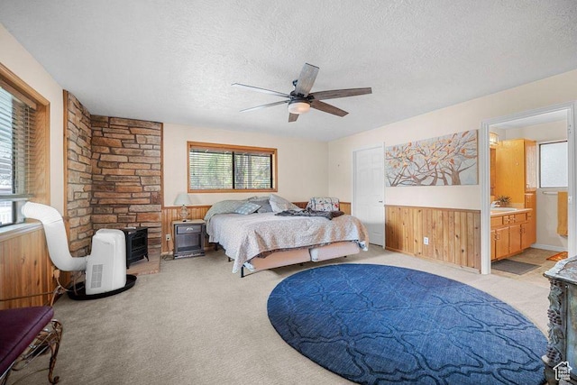835 E Mountain View Dr, Pine Valley, UT 84781 - bedroom featuring a textured ceiling, light colored carpet, and wainscoting
