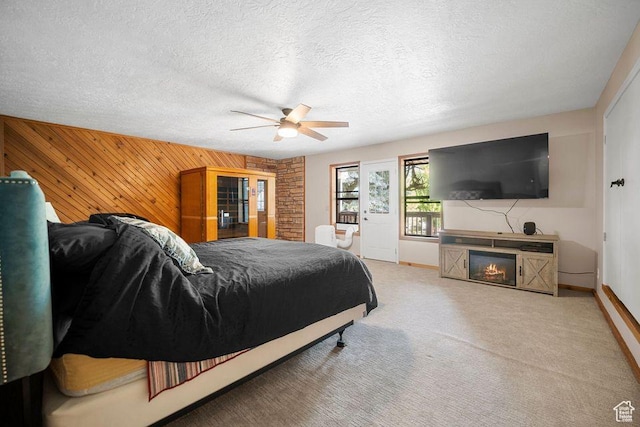 835 E Mountain View Dr, Pine Valley, UT 84781 - bedroom featuring wood walls, a ceiling fan, carpet flooring, and baseboards