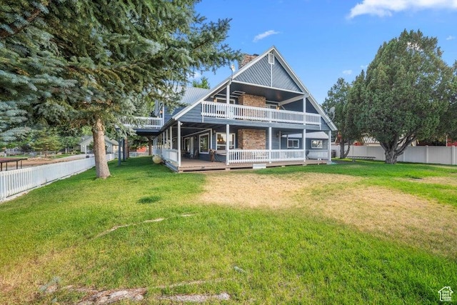 835 E Mountain View Dr, Pine Valley, UT 84781 - rear view of house with a wooden deck, a lawn, a chimney, and fence