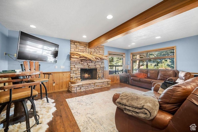 835 E Mountain View Dr, Pine Valley, UT 84781 - living room featuring recessed lighting, a stone fireplace, wood-type flooring, beamed ceiling, and wainscoting