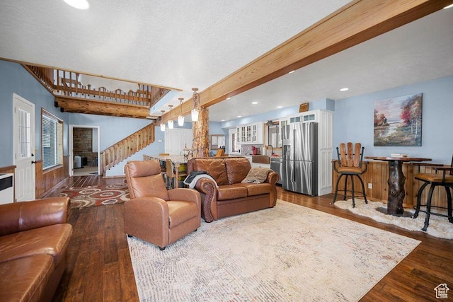 835 E Mountain View Dr, Pine Valley, UT 84781 - living room with stairs, decorative columns, dark wood-type flooring, beam ceiling, and recessed lighting