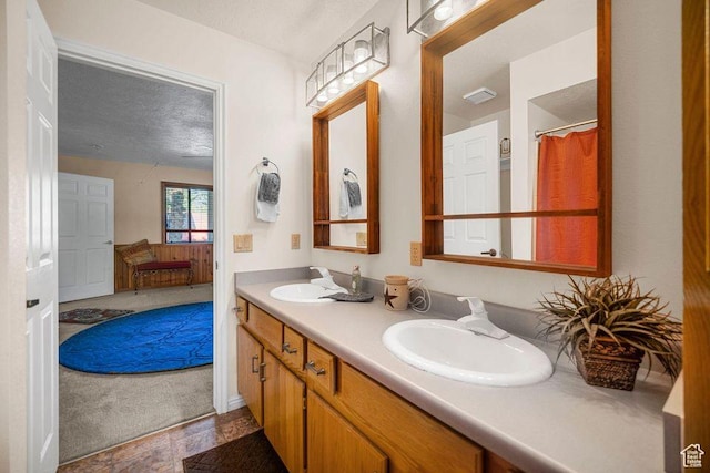 835 E Mountain View Dr, Pine Valley, UT 84781 - bathroom with a sink, a textured ceiling, and double vanity