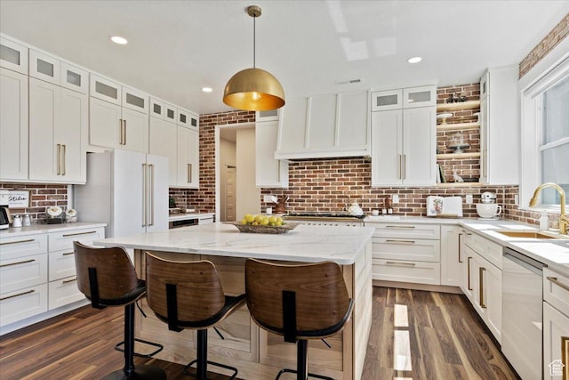 5651 W Meadow Cir, Mountain Green, UT 84050 - kitchen featuring a sink, dark wood finished floors, appliances with stainless steel finishes, custom range hood, and a breakfast bar area