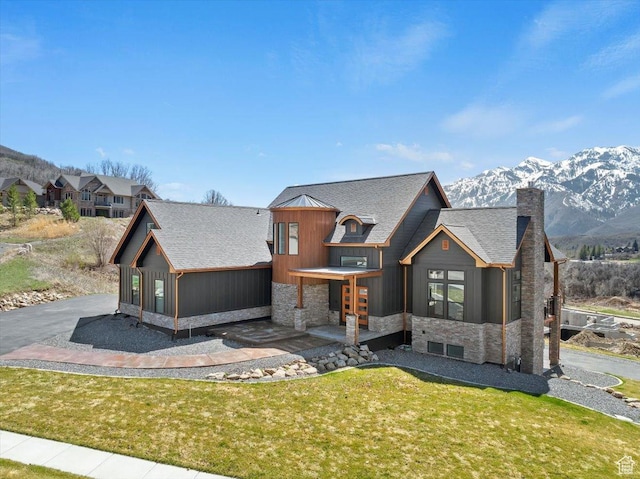 5651 W Meadow Cir, Mountain Green, UT 84050 - view of front of property featuring stone siding, a shingled roof, and board and batten siding