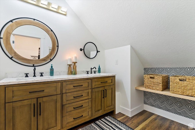 5651 W Meadow Cir, Mountain Green, UT 84050 - full bath featuring vaulted ceiling, wood finished floors, a sink, and double vanity
