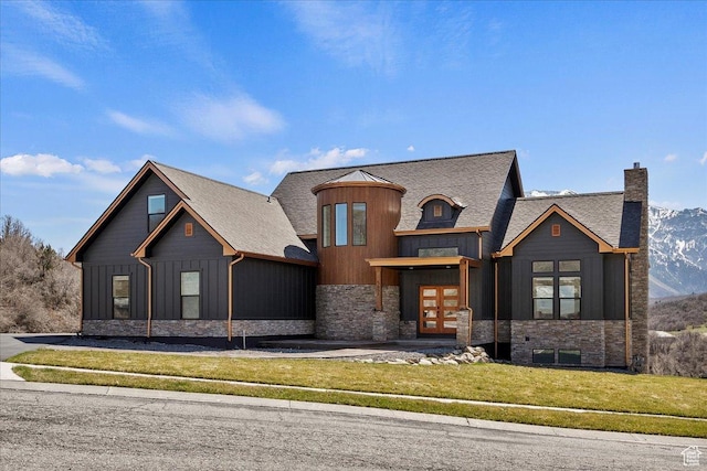 5651 W Meadow Cir, Mountain Green, UT 84050 - view of front of house featuring a chimney, a front lawn, board and batten siding, french doors, and stone siding