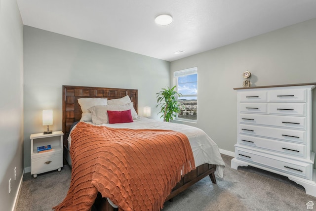 carpeted bedroom with visible vents and baseboards
