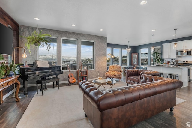 living room with recessed lighting and light wood finished floors