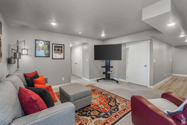 living area with recessed lighting and baseboards