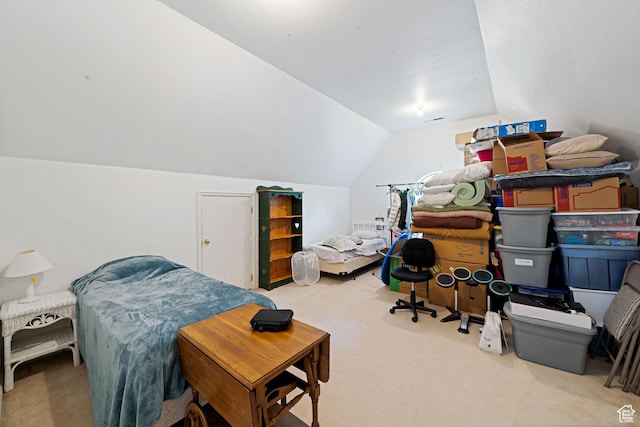 bedroom with vaulted ceiling and carpet flooring