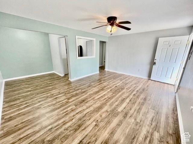 993 E 200 N, Provo, UT 84606 - unfurnished living room with baseboards, a ceiling fan, and wood finished floors