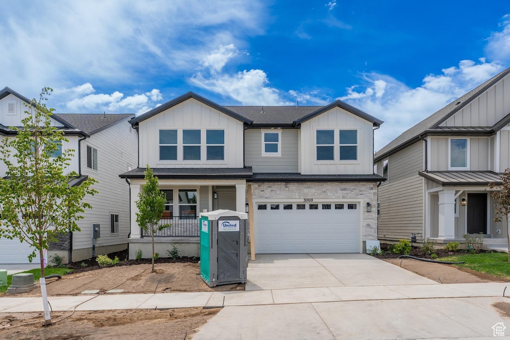 3869 W 950 N Unit 368, Lehi, UT 84043 - craftsman-style house featuring board and batten siding, driveway, a porch, and a garage