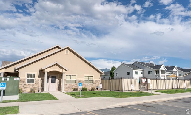 2522 W 500 S Unit 6, Springville, UT 84663 - view of front of property with fence, uncovered parking, a residential view, and stucco siding