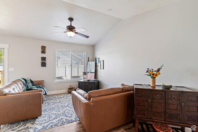 3295 S 1500 W, Perry, UT 84302 - living area with plenty of natural light, vaulted ceiling, wood finished floors, and a ceiling fan