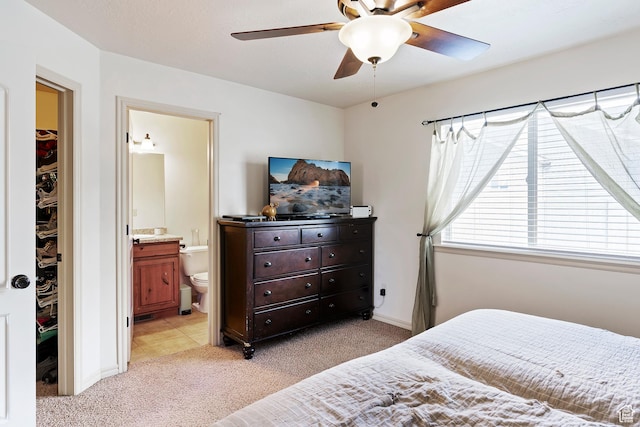 3295 S 1500 W, Perry, UT 84302 - bedroom featuring light colored carpet, baseboards, a ceiling fan, and ensuite bathroom