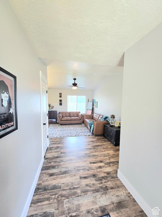 3295 S 1500 W, Perry, UT 84302 - hallway with a textured ceiling, baseboards, and wood finished floors