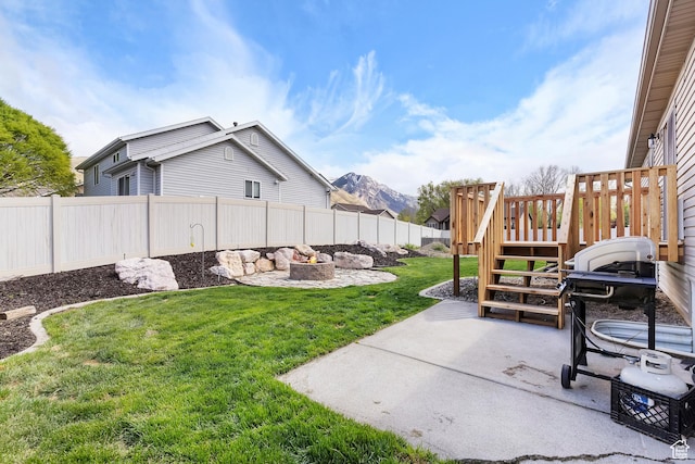 3295 S 1500 W, Perry, UT 84302 - view of yard with a fenced backyard, a patio area, and an outdoor fire pit