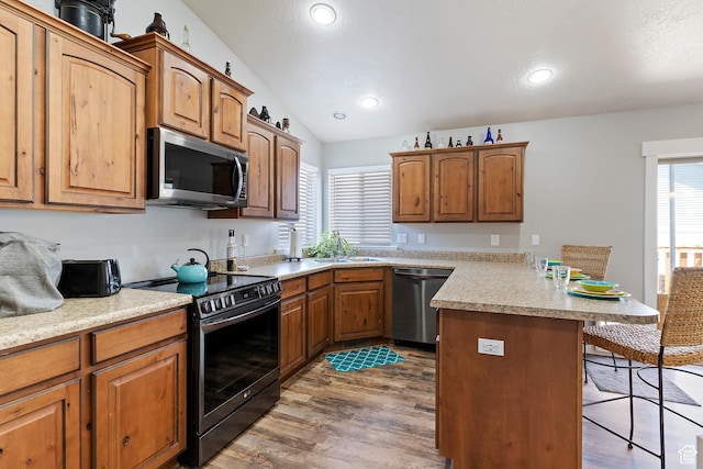 3295 S 1500 W, Perry, UT 84302 - kitchen with a peninsula, a wealth of natural light, a kitchen breakfast bar, and stainless steel appliances
