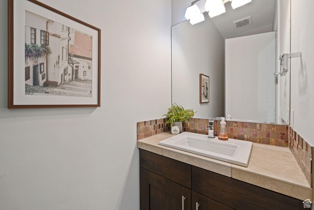 2356 S 1300 W, St George, UT 84770 - bathroom with visible vents, vanity, and tasteful backsplash