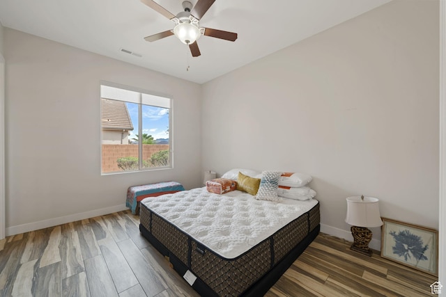 2356 S 1300 W, St George, UT 84770 - bedroom featuring wood finished floors, visible vents, baseboards, and ceiling fan