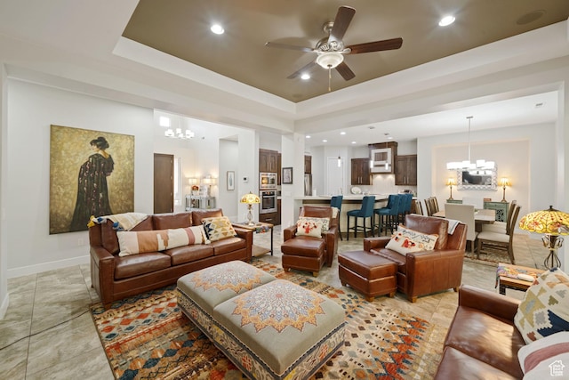 2356 S 1300 W, St George, UT 84770 - living area featuring a raised ceiling, baseboards, recessed lighting, and ceiling fan with notable chandelier