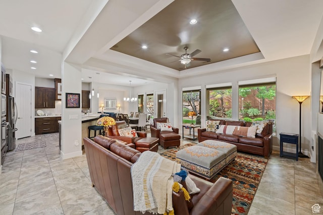 2356 S 1300 W, St George, UT 84770 - living area featuring ceiling fan with notable chandelier, baseboards, recessed lighting, and a raised ceiling