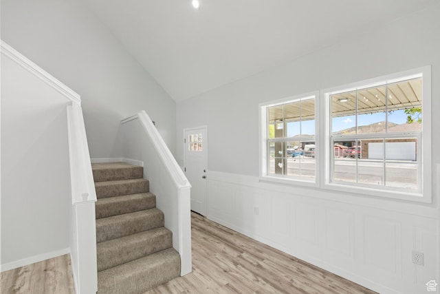 604 S Desert Willow Ln, Salina, UT 84654 - stairs featuring lofted ceiling, wood finished floors, a healthy amount of sunlight, and wainscoting