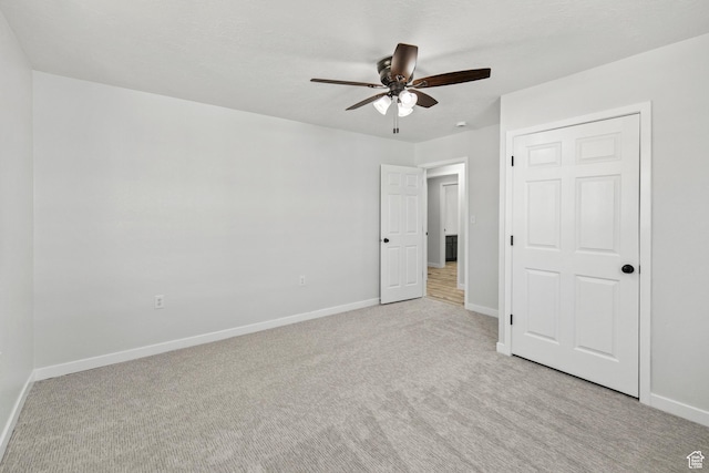 604 S Desert Willow Ln, Salina, UT 84654 - unfurnished bedroom with a ceiling fan, light colored carpet, and baseboards