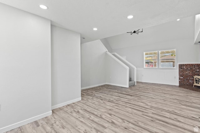 604 S Desert Willow Ln, Salina, UT 84654 - unfurnished living room featuring wood finished floors, recessed lighting, baseboards, and stairs