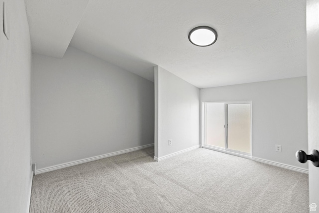 604 S Desert Willow Ln, Salina, UT 84654 - empty room featuring a textured ceiling, carpet flooring, and baseboards