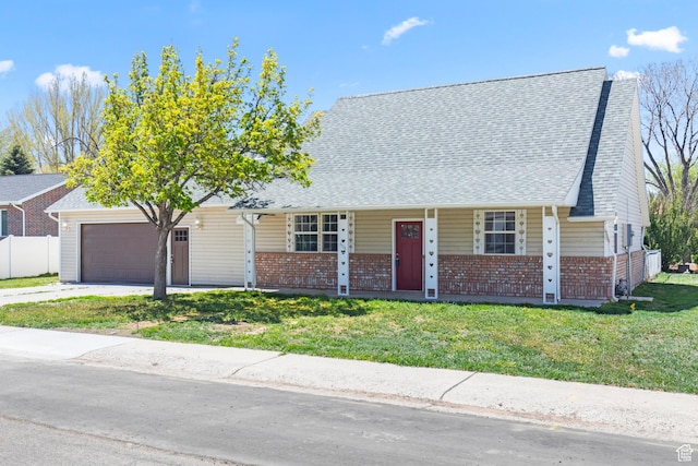 604 S Desert Willow Ln, Salina, UT 84654 - view of front facade with a front yard, an attached garage, covered porch, and brick siding