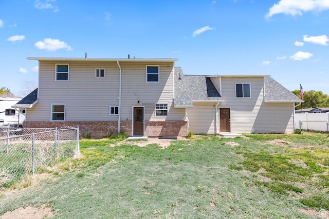 604 S Desert Willow Ln, Salina, UT 84654 - back of property with brick siding, roof with shingles, a yard, and fence