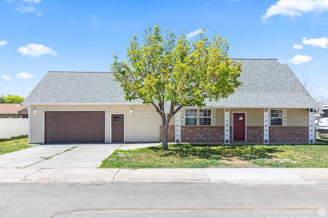 view of front of home with driveway, roof with shingles, a porch, brick siding, and a garage