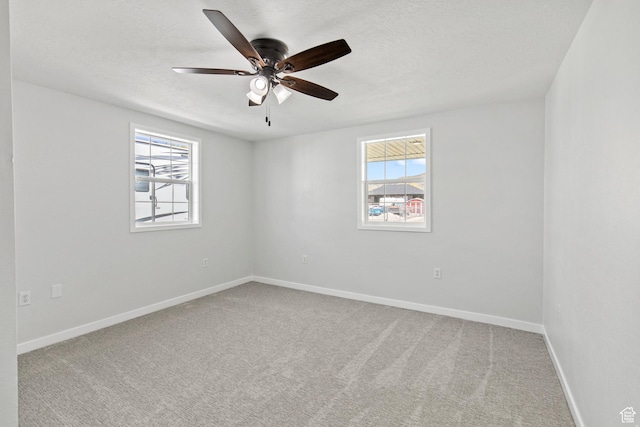 604 S Desert Willow Ln, Salina, UT 84654 - unfurnished room with a healthy amount of sunlight, a ceiling fan, and baseboards