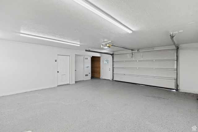 604 S Desert Willow Ln, Salina, UT 84654 - garage featuring a garage door opener and baseboards
