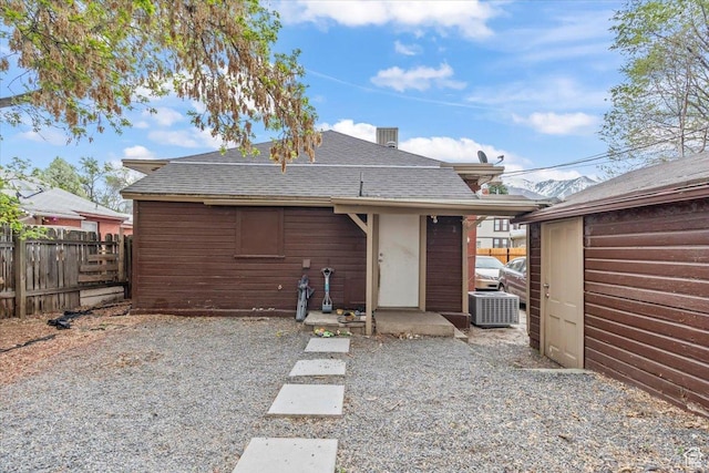 2669 S Liberty Ave E, Ogden, UT 84401 - back of property with cooling unit, roof with shingles, and fence