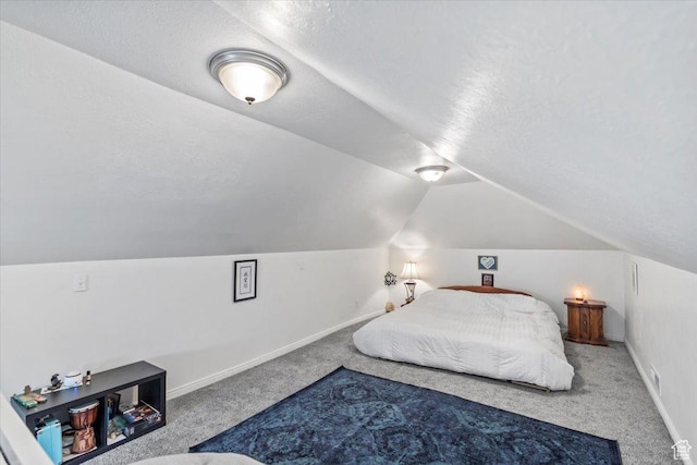 2669 S Liberty Ave E, Ogden, UT 84401 - carpeted bedroom with vaulted ceiling, a textured ceiling, and baseboards