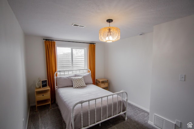64 Winding Way, Logan, UT 84321 - bedroom featuring baseboards, a notable chandelier, carpet flooring, and visible vents