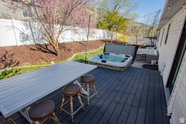 64 Winding Way, Logan, UT 84321 - deck featuring a covered hot tub and a fenced backyard