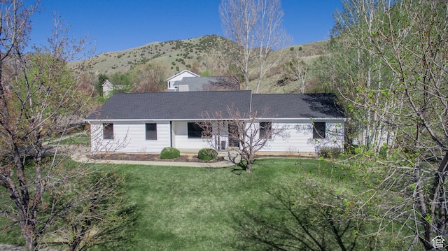 64 Winding Way, Logan, UT 84321 - ranch-style house featuring a shingled roof, a front lawn, and a mountain view