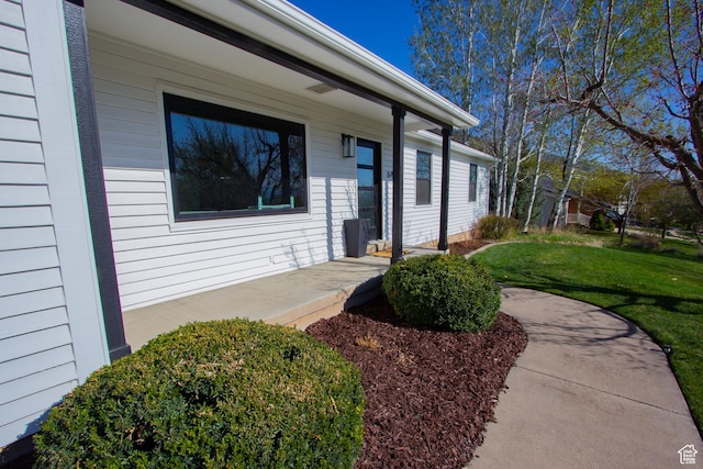 64 Winding Way, Logan, UT 84321 - doorway to property featuring a lawn
